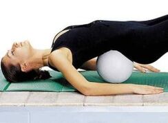 Exercise with a roll under the lower rear