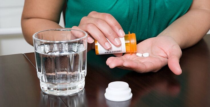 bottom takes pills to relieve pain